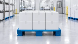 Illustrative blue flat-deck three-runner plastic pallet carrying sealed cartons in a clean packaging warehouse